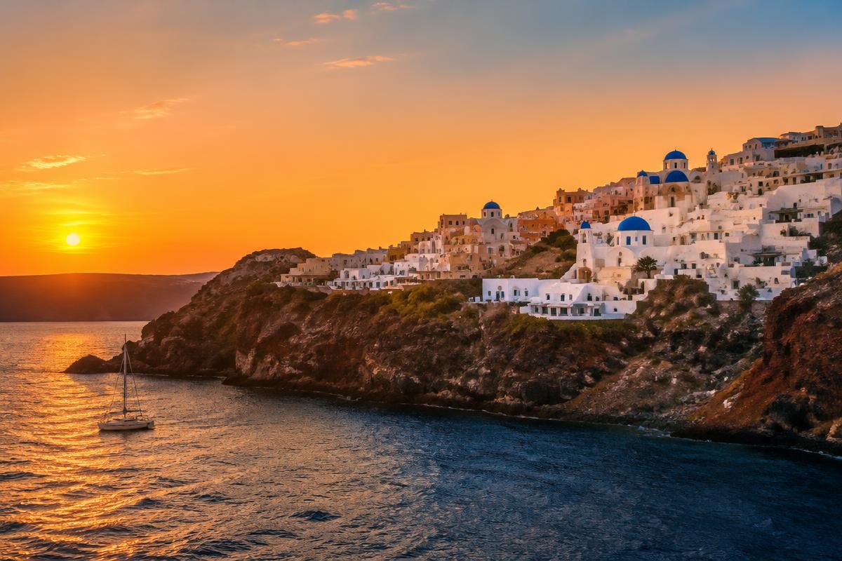 Santorini caldera at sunset seen from the water